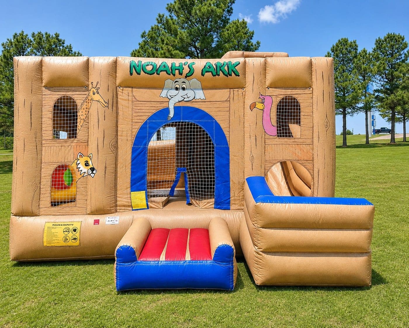 Noah's Ark themed commercial bounce house with animal characters, a large jumping zone, and an attached dry slide